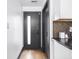Entryway featuring modern doors, neutral walls, and wood-look flooring at 928 E Pleasant Run Parkway North Dr, Indianapolis, IN 46203