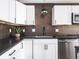 Close-up of kitchen features dark countertops, and stainless steel appliances at 928 E Pleasant Run Parkway North Dr, Indianapolis, IN 46203
