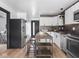 Modern kitchen featuring stainless steel appliances, and an island with seating at 928 E Pleasant Run Parkway North Dr, Indianapolis, IN 46203
