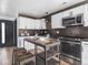 Well-appointed kitchen boasting white cabinetry and stylish backsplash at 928 E Pleasant Run Parkway North Dr, Indianapolis, IN 46203