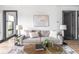 Cozy living room with a comfortable sofa, decorative lamps, and stylish decor at 928 E Pleasant Run Parkway North Dr, Indianapolis, IN 46203