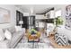 Stylish living room showcasing hardwood floors and an open layout to the kitchen at 928 E Pleasant Run Parkway North Dr, Indianapolis, IN 46203