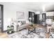 Open-concept living room featuring modern decor and seamless flow into the kitchen at 928 E Pleasant Run Parkway North Dr, Indianapolis, IN 46203