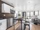 Open living space featuring modern kitchen, dining area, and a living room with natural light at 928 E Pleasant Run Parkway North Dr, Indianapolis, IN 46203