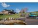 Lakeside backyard featuring a fire pit, lounge chairs, kayaks, and staircase to house at 9398 W Mirror Rd, Columbus, IN 47201
