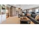 Basement sitting area with fireplace and views into the dining and kitchen area at 9398 W Mirror Rd, Columbus, IN 47201