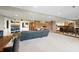 Basement featuring an entertainment area, fireplace, kitchen, and dining table at 9398 W Mirror Rd, Columbus, IN 47201