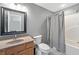 Practical bathroom with neutral tones, a vanity, toilet, and shower-tub combination at 9398 W Mirror Rd, Columbus, IN 47201