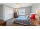 Bright bedroom with a water view, ceiling fan, and dresser at 9398 W Mirror Rd, Columbus, IN 47201