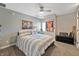 Cozy bedroom with striped bedding, ceiling fan, and sports decor at 9398 W Mirror Rd, Columbus, IN 47201