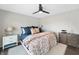 Relaxing bedroom with a ceiling fan and large windows, perfect for a peaceful retreat at 9398 W Mirror Rd, Columbus, IN 47201