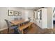 Dining room boasts a farmhouse table, built-in cabinets, and stylish decor at 9398 W Mirror Rd, Columbus, IN 47201
