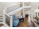 Welcoming foyer with hardwood floors, staircase, and stylish decor at 9398 W Mirror Rd, Columbus, IN 47201