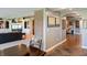 Basement hallway featuring a wet bar area and an entertainment room with a fireplace at 9398 W Mirror Rd, Columbus, IN 47201