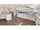 Spacious kitchen with white cabinetry, granite countertops, and an open layout to the living room at 9398 W Mirror Rd, Columbus, IN 47201