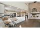 Open floor plan connects kitchen to living area with fireplace, creating a welcoming atmosphere at 9398 W Mirror Rd, Columbus, IN 47201