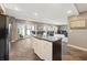 Wet bar in the basement with island, sink, and bar seating, with access to the patio at 9398 W Mirror Rd, Columbus, IN 47201