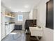 Laundry room with custom white cabinets, sink, and front load washer and dryer at 9398 W Mirror Rd, Columbus, IN 47201