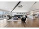 Spacious living room with hardwood floors, natural light, comfortable seating and a modern, open kitchen at 9398 W Mirror Rd, Columbus, IN 47201
