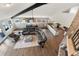 Spacious living room with hardwood floors, fireplace, and large leather sectional at 9398 W Mirror Rd, Columbus, IN 47201