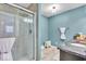 Modern bathroom featuring a glass-enclosed shower, granite vanity and elegant light fixtures at 9715 Mallery Dr, Noblesville, IN 46060