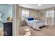Comfortable bedroom featuring plush carpeting, a full-size bed and two windows at 9715 Mallery Dr, Noblesville, IN 46060