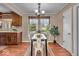 Eat-in kitchen featuring wood cabinets, natural light and seating for four at 9715 Mallery Dr, Noblesville, IN 46060