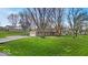 Charming single-story home featuring a well-maintained lawn, attached garage and beautiful landscaping at 9715 Mallery Dr, Noblesville, IN 46060