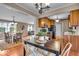 Open concept kitchen and dining area featuring stainless appliances and hardwood floors at 9715 Mallery Dr, Noblesville, IN 46060