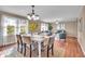 Open concept dining and living room area featuring hardwood floors and neutral paint at 9715 Mallery Dr, Noblesville, IN 46060
