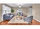 Cozy living room with wood floors, neutral walls, and stylish gray furniture at 9715 Mallery Dr, Noblesville, IN 46060
