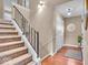 Beautiful stairway with carpet steps, iron railing, and modern lighting at 9715 Mallery Dr, Noblesville, IN 46060