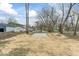 Large backyard with room for outdoor activities and gardening at 1049 N Traub Ave, Indianapolis, IN 46222