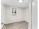 An airy bedroom with wood flooring and ample natural light from a window at 1049 N Traub Ave, Indianapolis, IN 46222