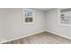 Inviting bedroom with neutral paint, modern flooring, and plenty of natural light at 1049 N Traub Ave, Indianapolis, IN 46222