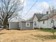 Exterior view shows a house with mixed siding at 1049 N Traub Ave, Indianapolis, IN 46222