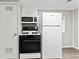 A bright kitchen featuring modern appliances, ample counter space, and storage at 1049 N Traub Ave, Indianapolis, IN 46222