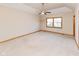 Spacious carpeted bedroom features a tray ceiling, ceiling fan, and window at 1114 Woodridge, Brownsburg, IN 46112