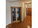 Hallway with hardwood floors and wood doors leading to other rooms at 1114 Woodridge, Brownsburg, IN 46112