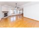 Bright and airy living room featuring hardwood floors, fireplace, and open floor plan at 1114 Woodridge, Brownsburg, IN 46112