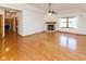 Open living space with hardwood floors, fireplace, and view into adjacent rooms at 1114 Woodridge, Brownsburg, IN 46112
