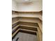 Large walk-in pantry with wooden shelving, providing ample storage space at 1114 Woodridge, Brownsburg, IN 46112