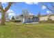 Backyard of a charming home featuring a concrete patio area, and an expansive lawn at 1240 Wayne St, Noblesville, IN 46060