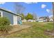 Backyard with a patio area, a green chair, and a well-maintained lawn at 1240 Wayne St, Noblesville, IN 46060