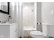 Bright bathroom showcasing modern tiles, new fixtures, and a convenient shower at 1240 Wayne St, Noblesville, IN 46060