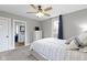 Cozy bedroom featuring a ceiling fan, neutral walls, and an ensuite bathroom for added convenience at 1240 Wayne St, Noblesville, IN 46060