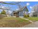 Lovely blue house with a covered porch, green lawn and beautiful curb appeal at 1240 Wayne St, Noblesville, IN 46060