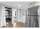 Efficient kitchen features stainless steel appliances and a washer/dryer combo for added convenience and modern living at 1240 Wayne St, Noblesville, IN 46060