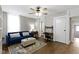 Bright and cozy living area with modern accents, desk and comfortable blue sofa at 1240 Wayne St, Noblesville, IN 46060