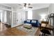 Bright and cozy living area with modern accents, desk and comfortable blue sofa at 1240 Wayne St, Noblesville, IN 46060